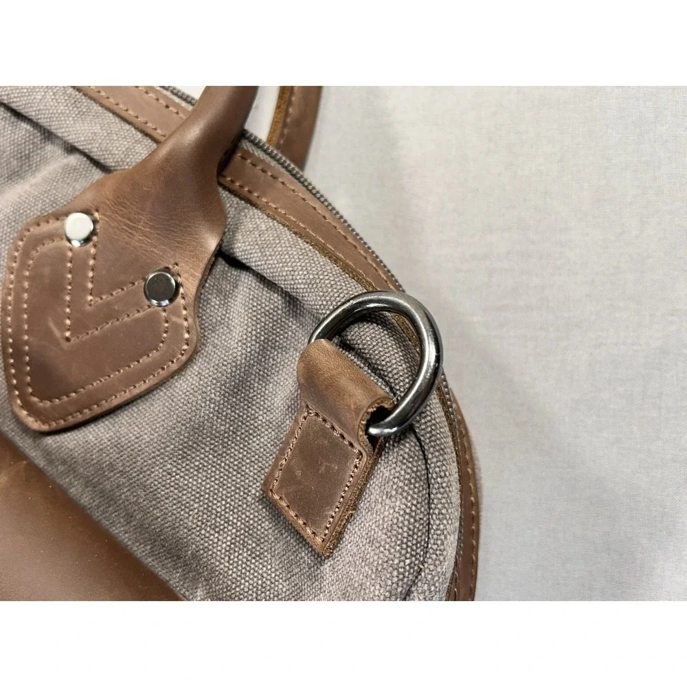 Renwick canvas briefcase featuring genuine leather trim missing shoulder strap